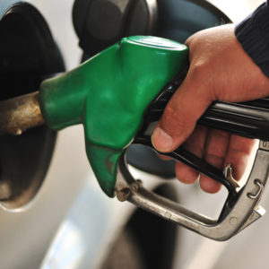 Man refilling the car with fuel on a filling station